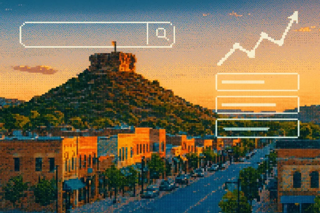 Pixelated panoramic view of a historic town nestled at the foot of a mountain, bathed in the warm light of the setting sun. The image includes a search bar icon.
